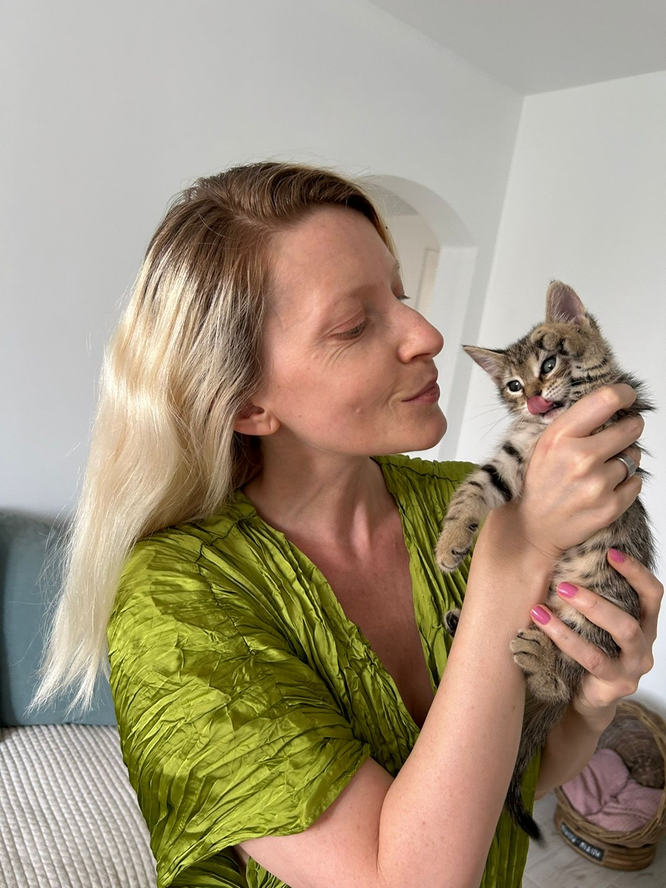 blonde woman with small cat
