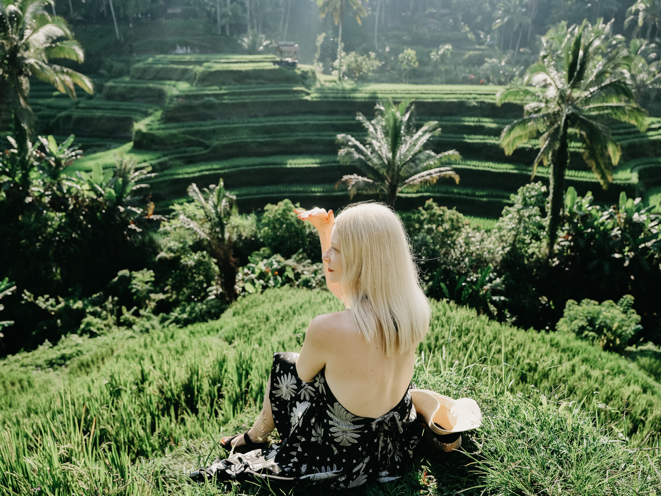blonde woman in a rice field in the morning