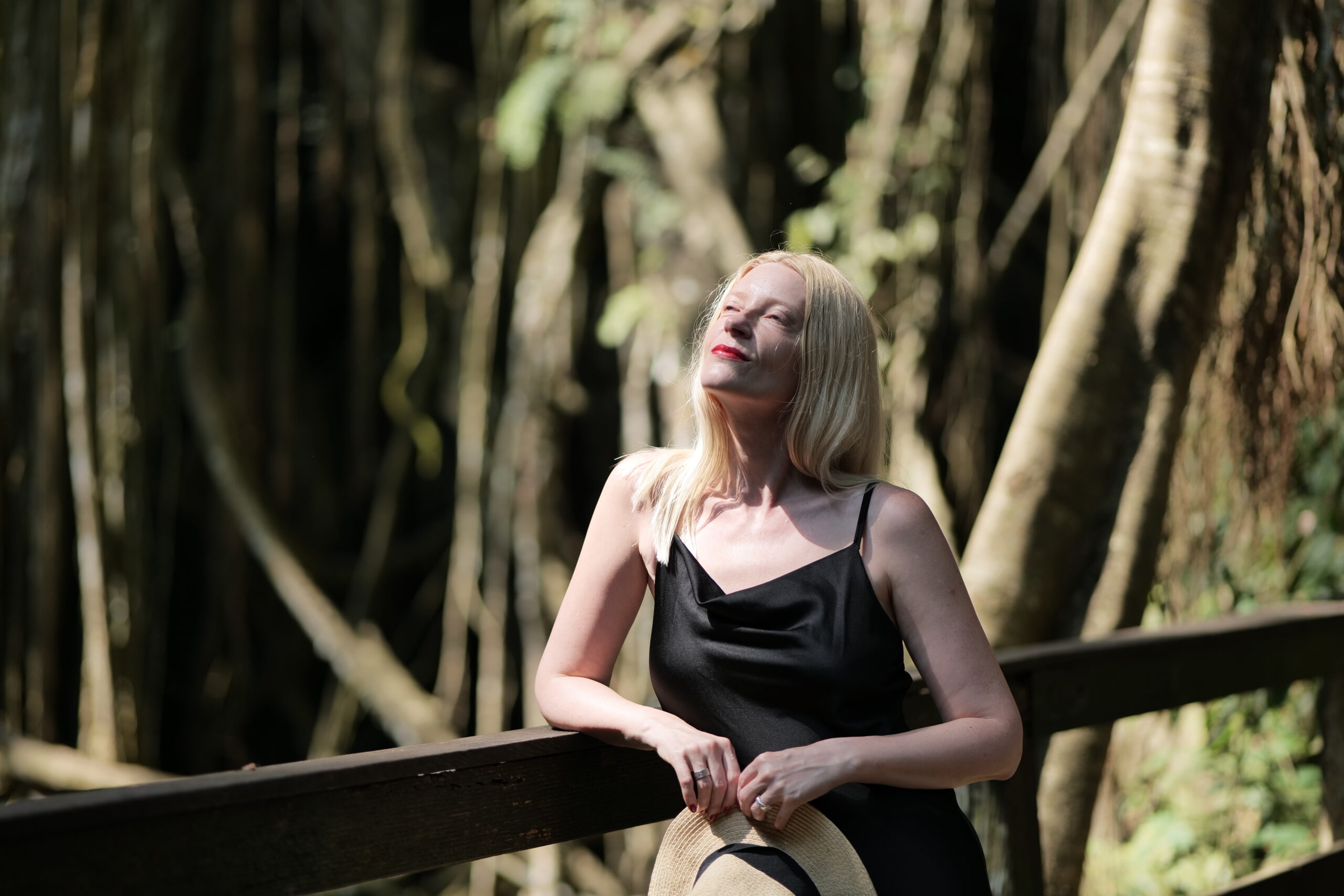 blonde women in the jungle on a sunny day