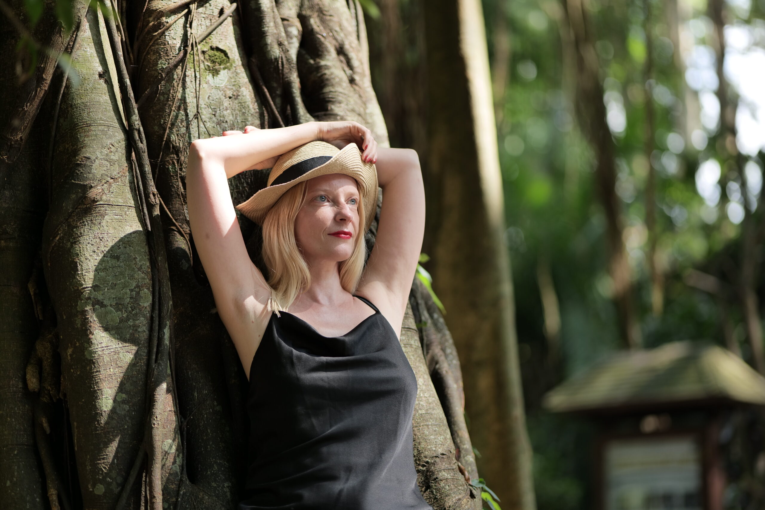 blonde woman near a mangrove tree